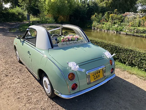 Nissan Figaro convertible wedding car with roof down