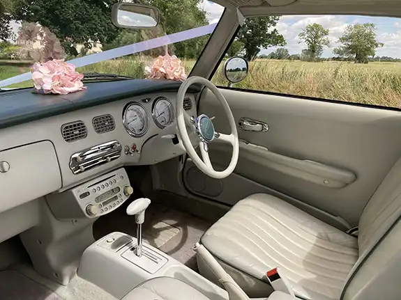 Retro interior of Nissan Figaro wedding hire car