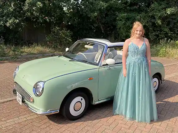 Nissan Figaro prom car hire convertible with roof down